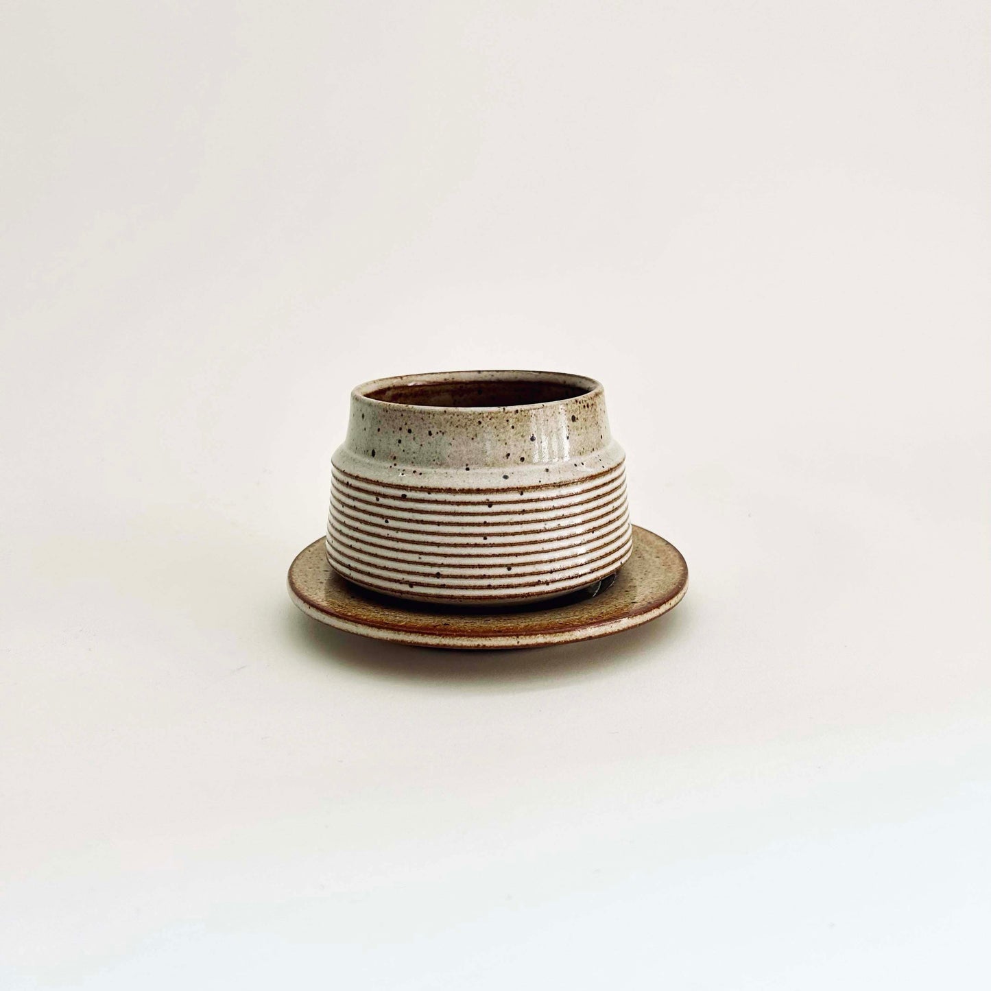 Tapered Textured Cup and Saucer Set in Warm White