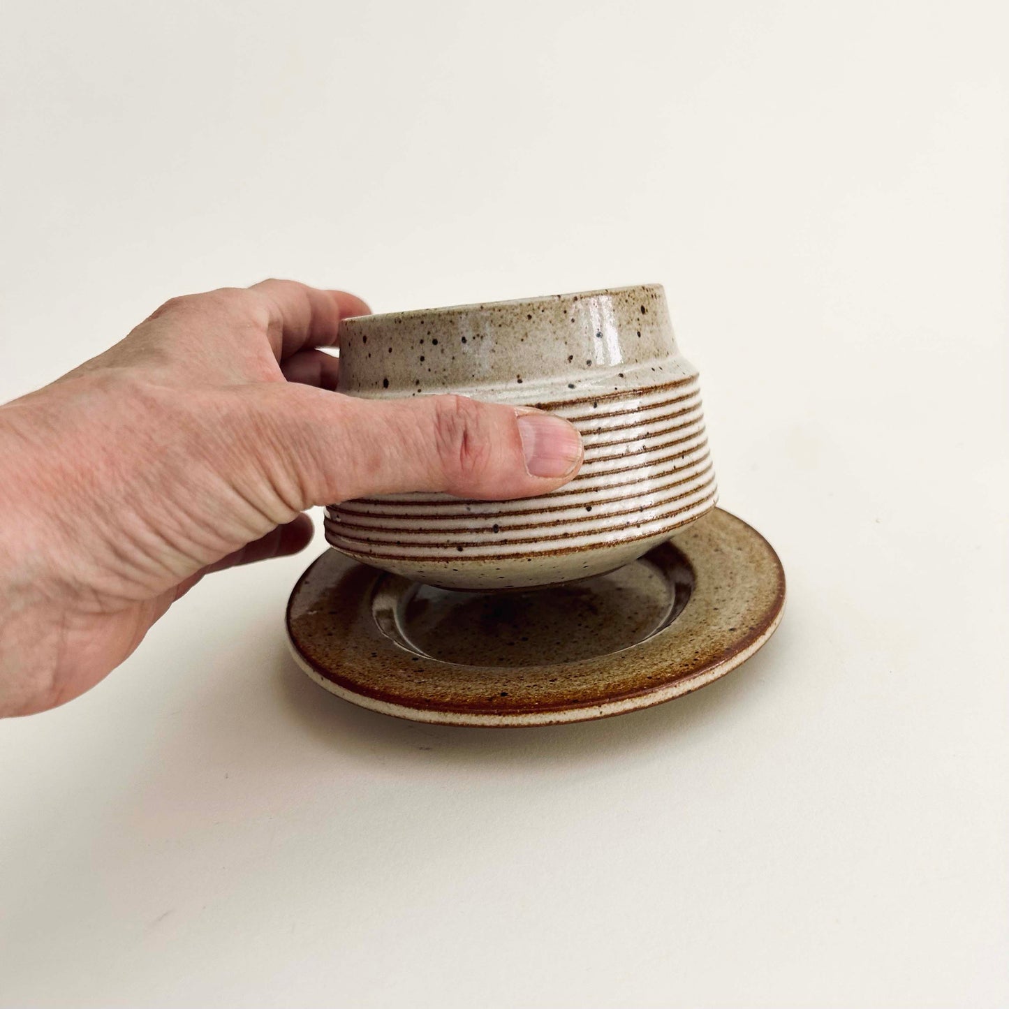 Tapered Textured Cup and Saucer Set in Warm White