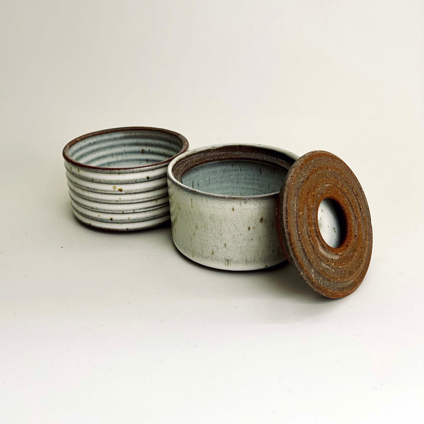 Two-Tiered Cylindrical Ribbed Lidded Container in Buttermilk