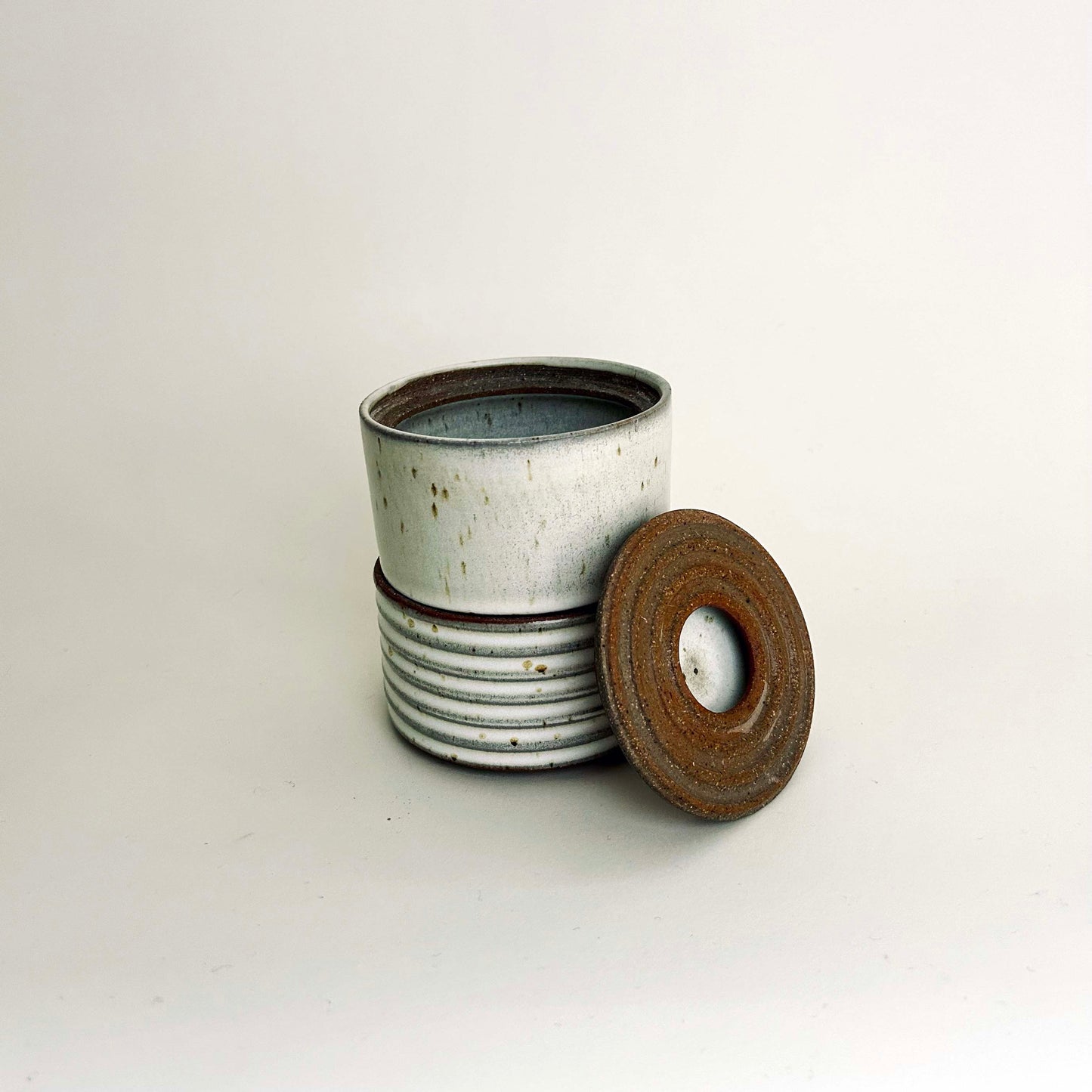 Two-Tiered Cylindrical Ribbed Lidded Container in Buttermilk