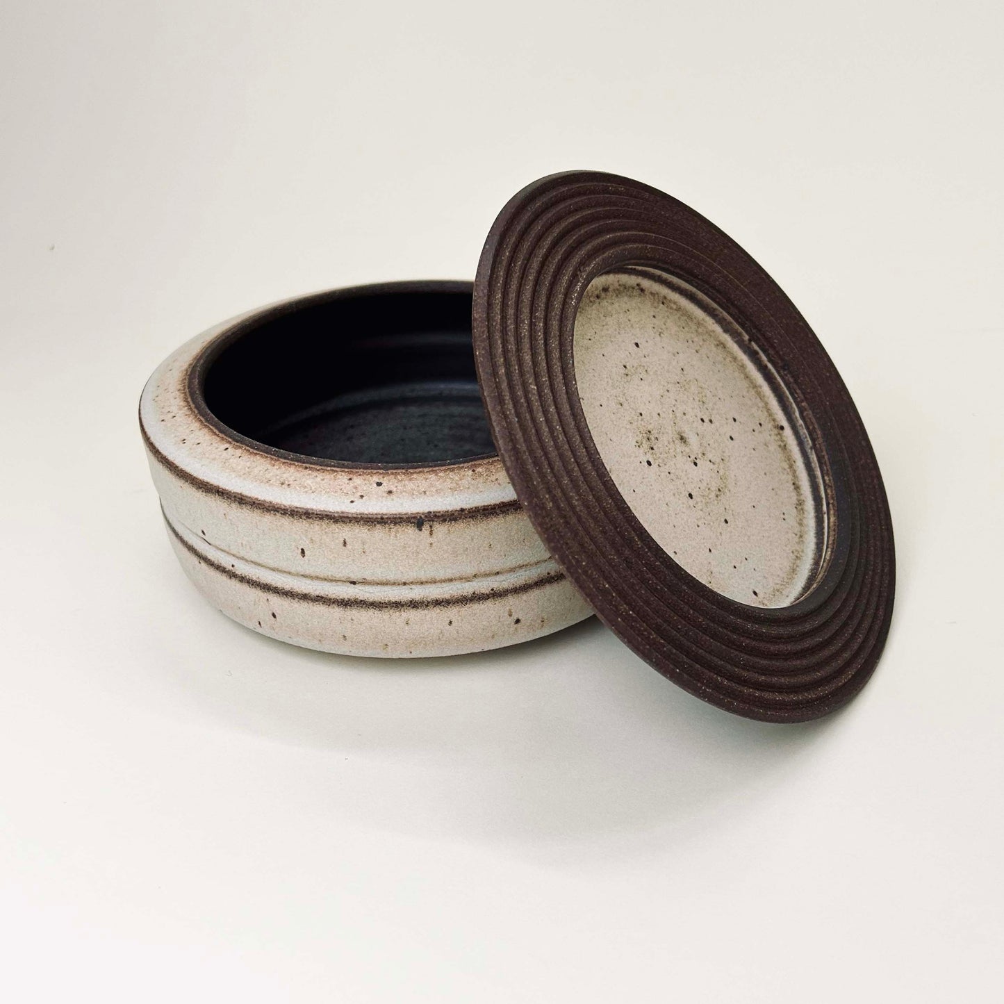 Wide, Cylindrical Vessel w/ Linear Textured Lid in Mocha Creme